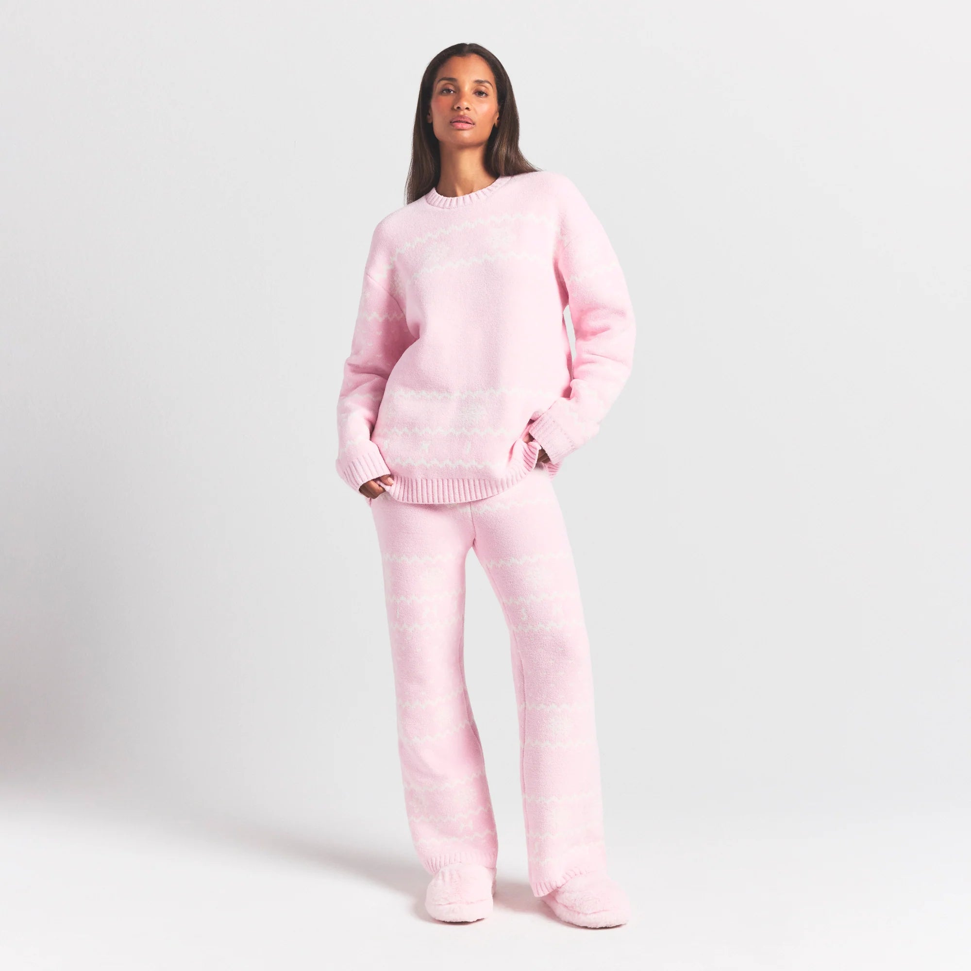 COZY LIGHT CREWNECK PULLOVER | BABY PINK HEART FAIR ISLE ON A MODEL FRONT VIEW @ | FOCUS: 0.0, 1.0, 0.9