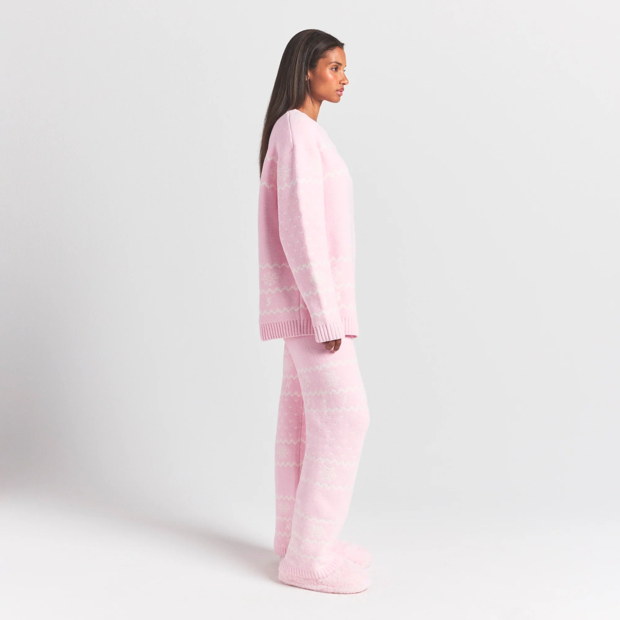 COZY LIGHT CREWNECK PULLOVER | BABY PINK HEART FAIR ISLE ON A MODEL SIDE VIEW @ | FOCUS: 0.0, 1.0, 0.9