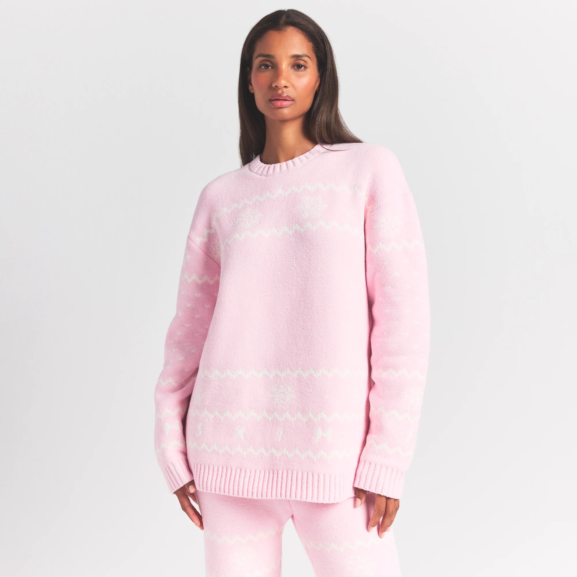 COZY LIGHT CREWNECK PULLOVER | BABY PINK HEART FAIR ISLE ON A MODEL SIDE VIEW @ | FOCUS: 0.0, 1.0, 0.9