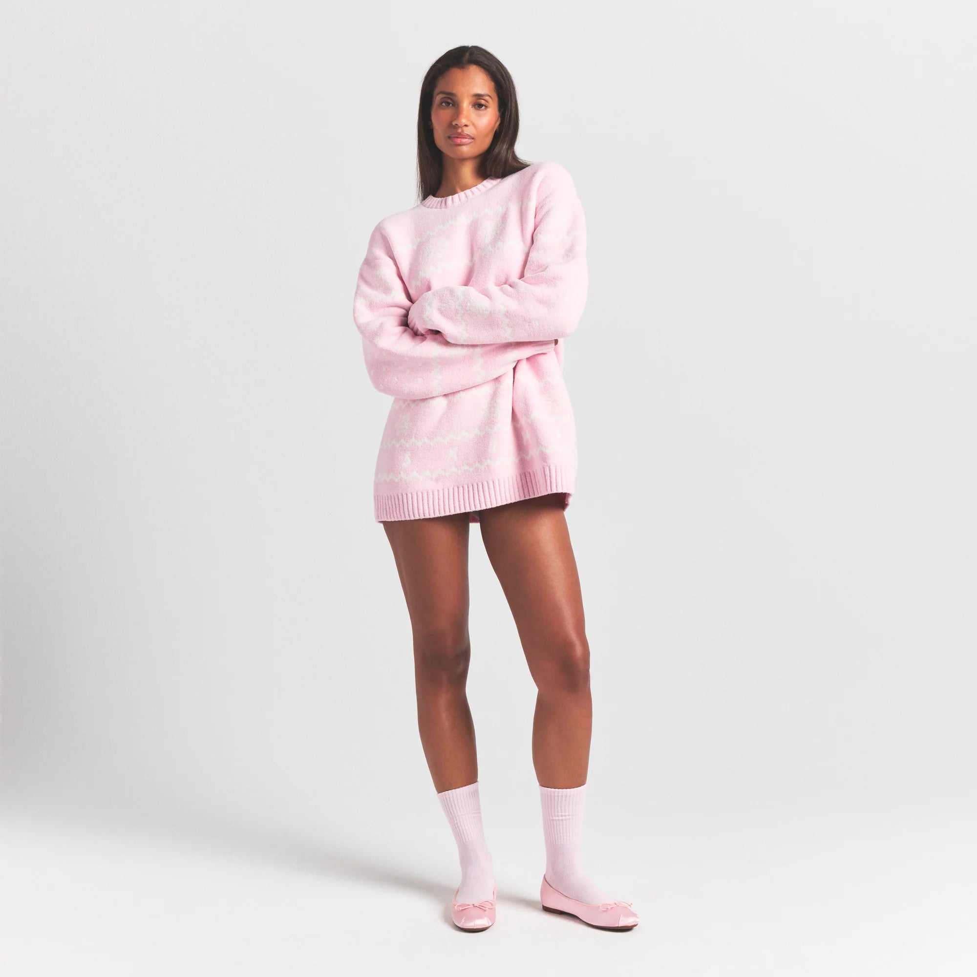 COZY LIGHT CREWNECK PULLOVER | BABY PINK HEART FAIR ISLE ON A MODEL FRONT VIEW @ | FOCUS: 0.0, 1.0, 0.9