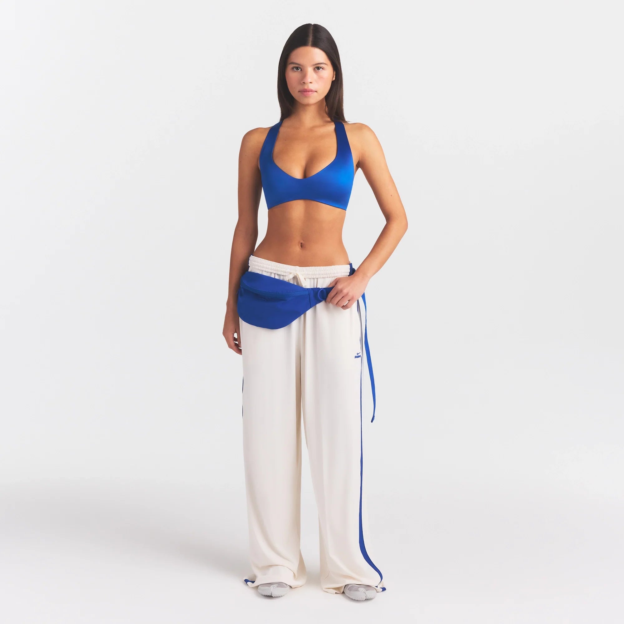 NikeSKIMS ACCESSORIES FANNY PACK | COBALT ON A MODEL FRONT VIEW @ | FOCUS: 0.0, 1.0, 0.9