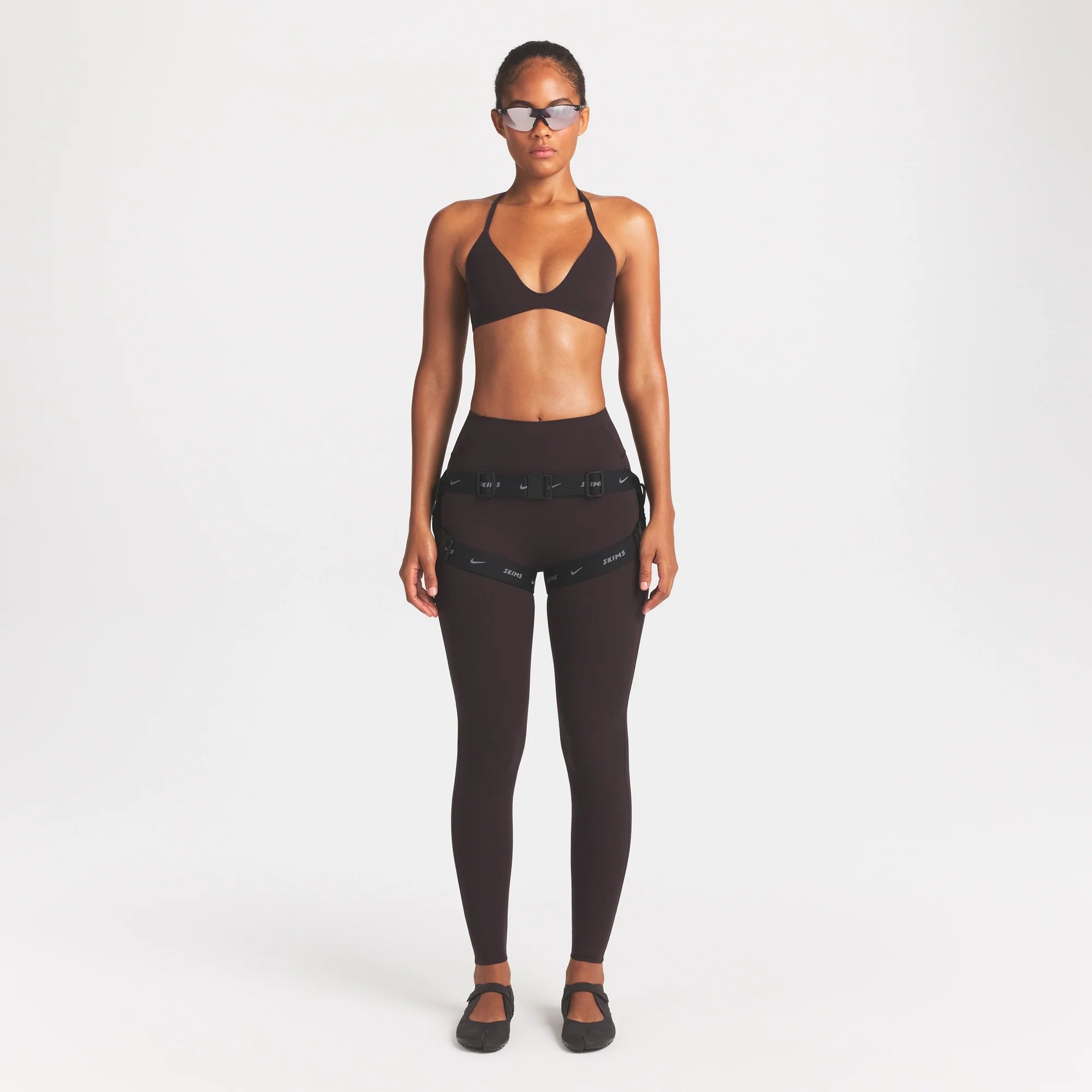 NikeSKIMS ACCESSORIES HARNESS WAISTPACK | OBSIDIAN ON A MODEL FRONT VIEW @ | FOCUS: 0.0, 1.0, 0.9
