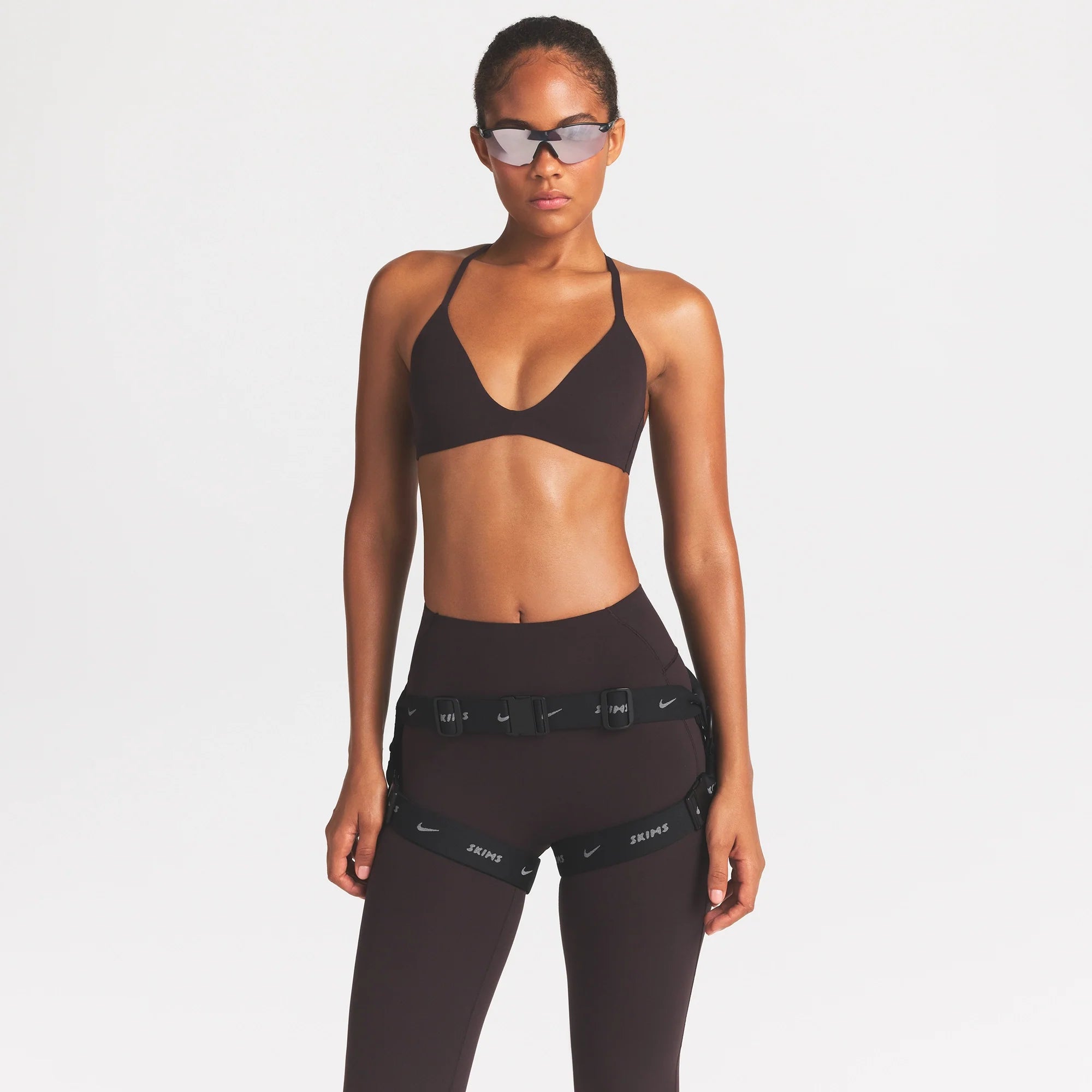 NikeSKIMS ACCESSORIES HARNESS WAISTPACK | OBSIDIAN ON A MODEL FRONT VIEW @ | FOCUS: 0.0, 1.0, 0.9