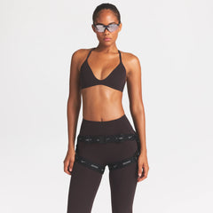 NikeSKIMS ACCESSORIES HARNESS WAISTPACK | OBSIDIAN ON A MODEL FRONT VIEW @ | FOCUS: 0.0, 1.0, 0.9