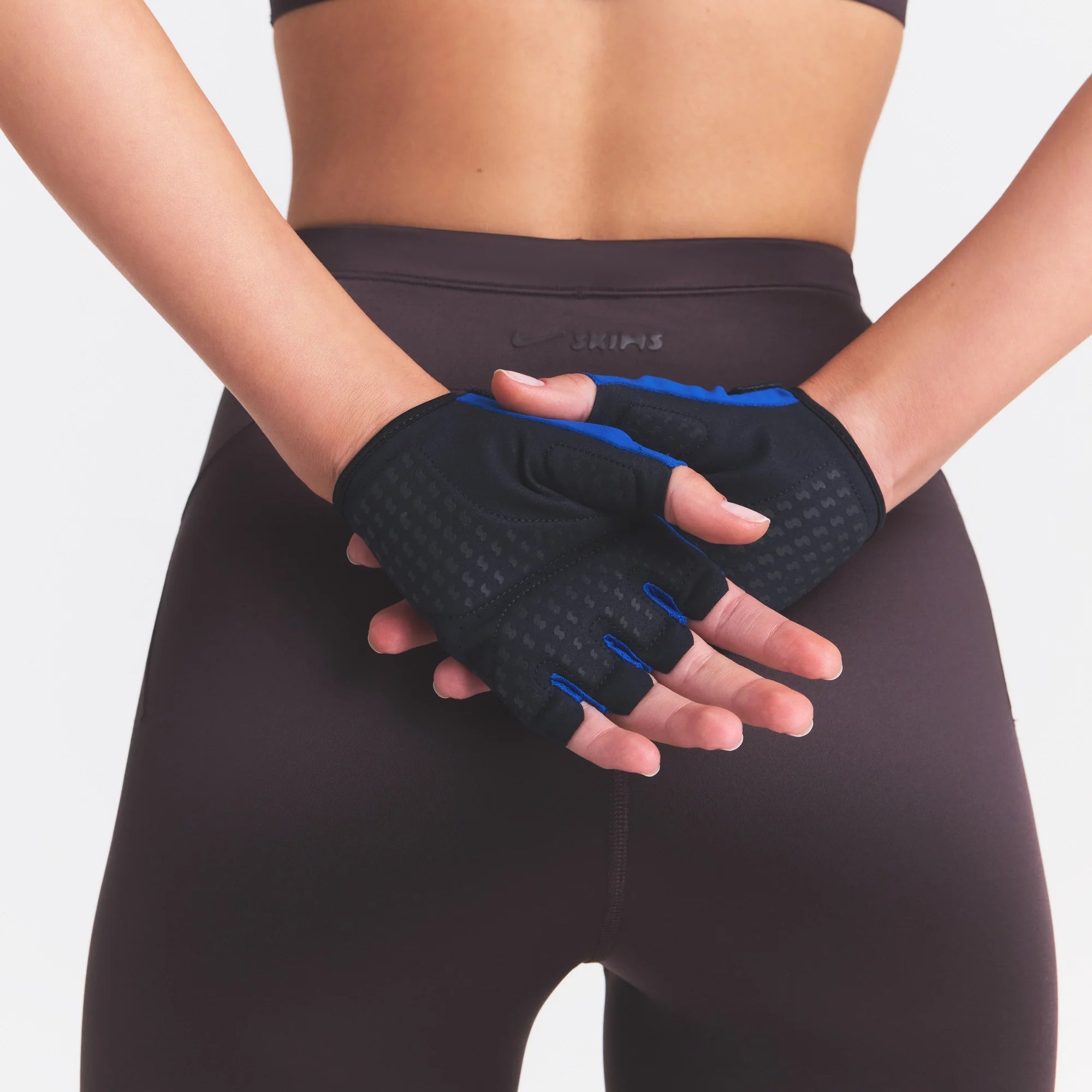NikeSKIMS ACCESSORIES TRAINING GLOVES | COBALT AND OBSIDIAN & LAYS FLAT ON A WHITE BACKGROUND | FLT