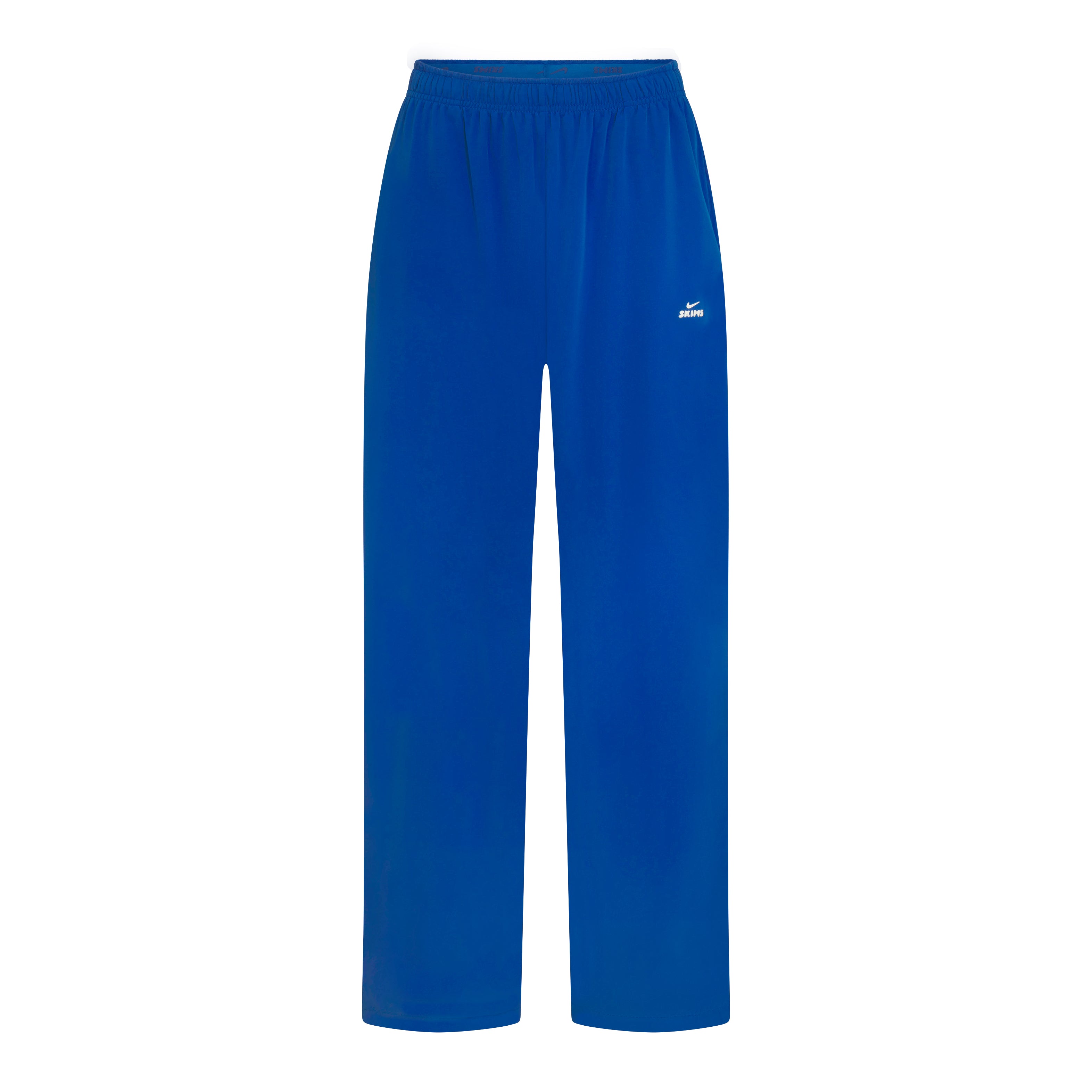 NikeSKIMS STRETCH NYLON OVERSIZED PANTS | NSKM COBALT FLAT ON A WHITE BACKGROUND | FLT