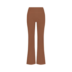 NikeSKIMS MATTE SLIM FLARE LEGGING | CAROB BROWN FLAT ON A WHITE BACKGROUND | FLT