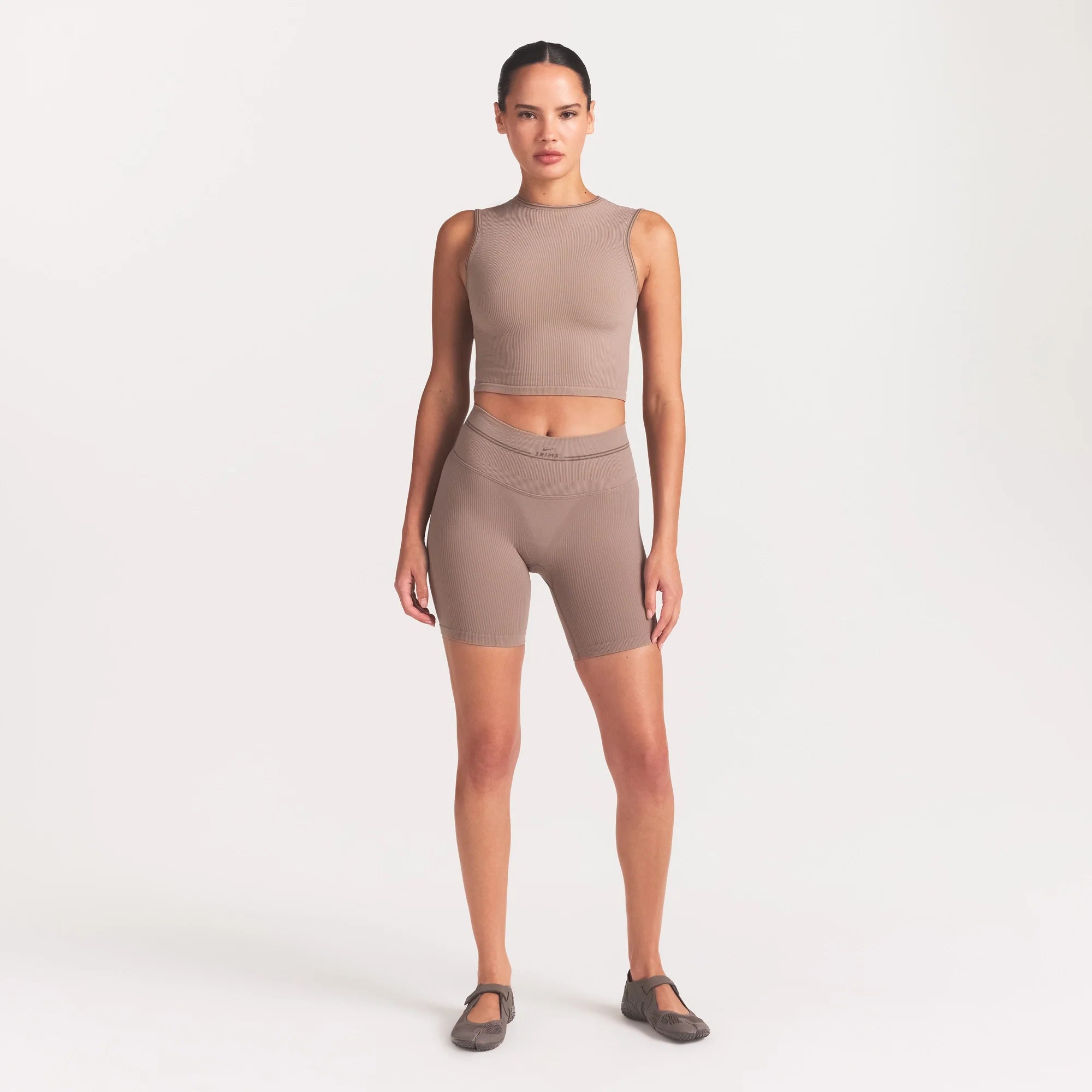NikeSKIMS RIBBED SEAMLESS 5" BIKER SHORT | DRIFTWOOD ON A MODEL FRONT VIEW @ | FOCUS: 0.0, 1.0, 0.9