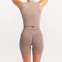 NikeSKIMS RIBBED SEAMLESS 5" BIKER SHORT | DRIFTWOOD ON A MODEL SIDE VIEW @ | FOCUS: 0.0, 1.0, 0.9