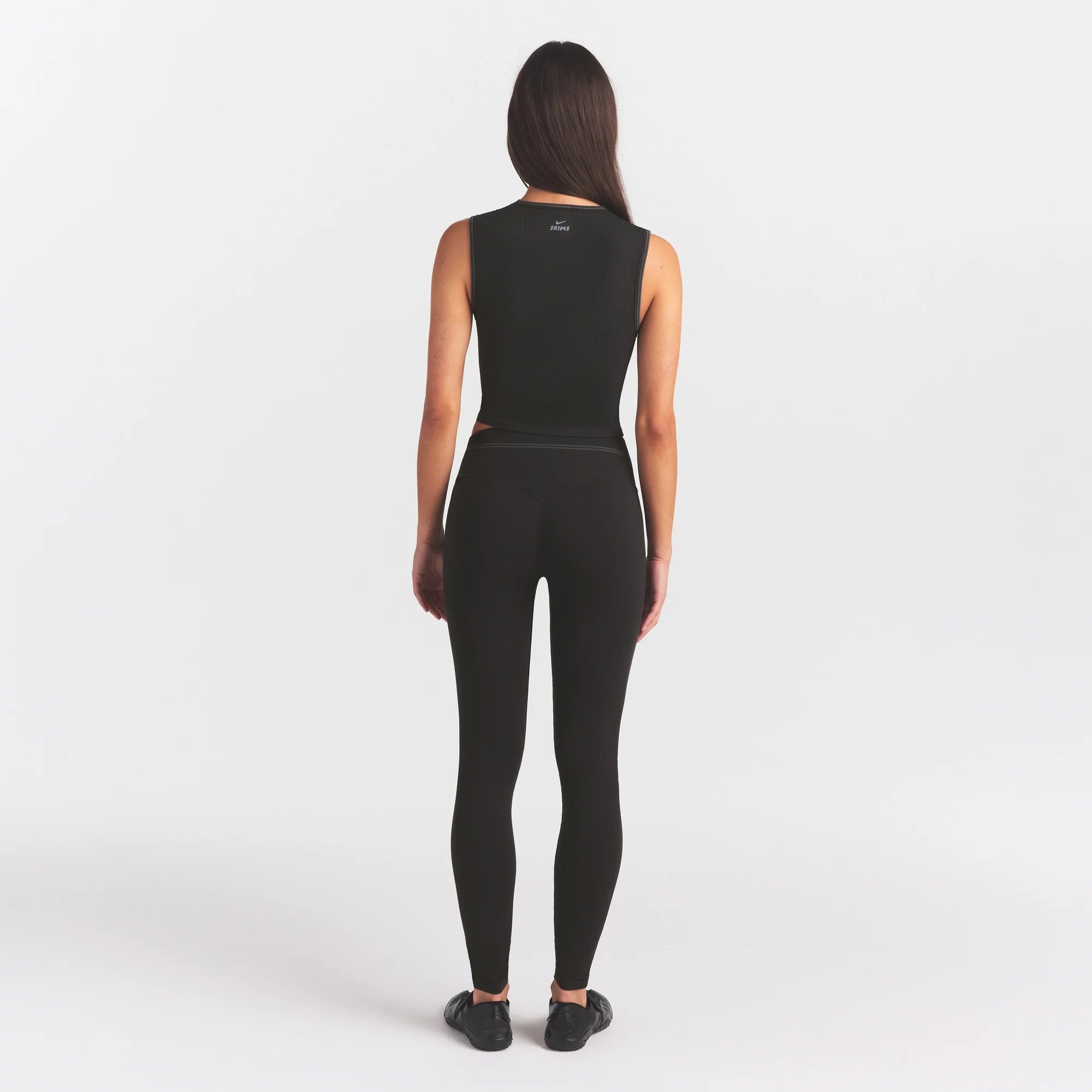 NikeSKIMS RIBBED SEAMLESS 26" LEGGING | OBSIDIAN ON A MODEL FRONT VIEW