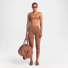 NikeSKIMS MATTE 5" BIKER SHORT |CAROB BROWN ON A MODEL FRONT VIEW @ | FOCUS: 0.0, 1.0, 0.9