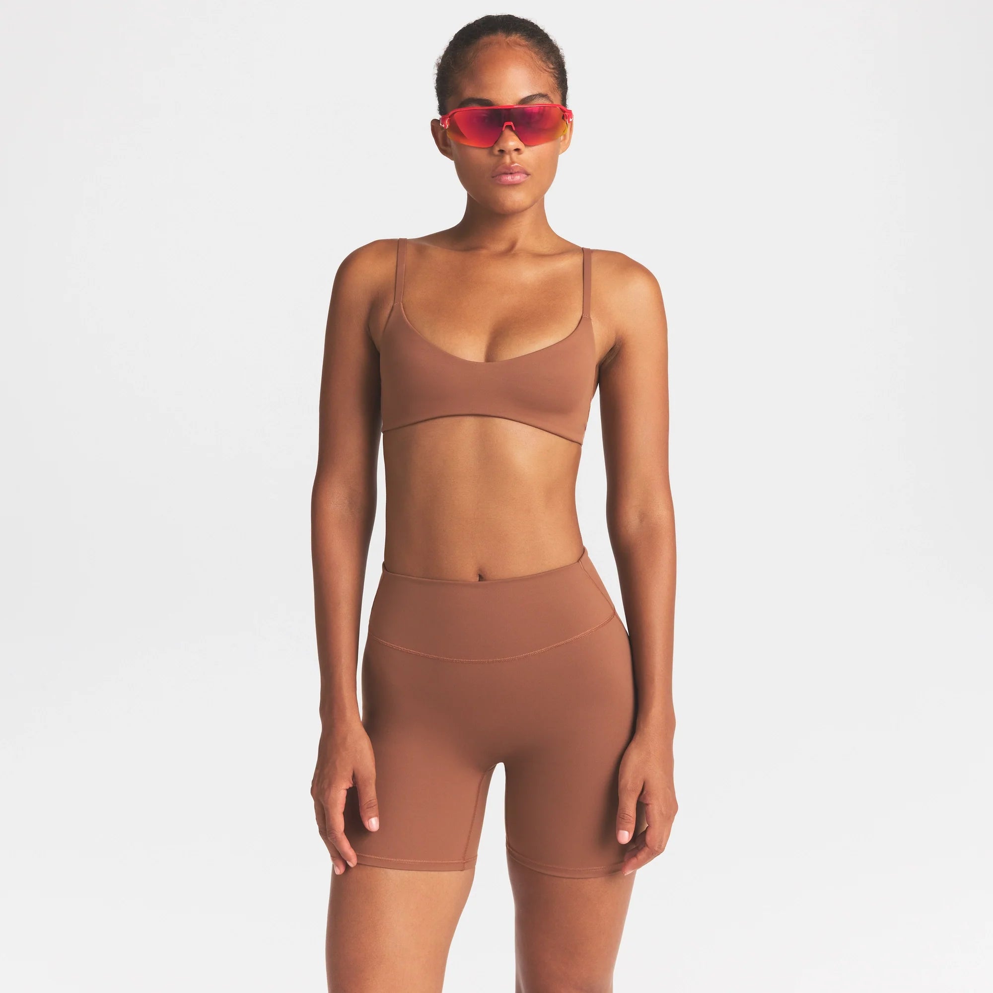 NikeSKIMS MATTE 5" BIKER SHORT |CAROB BROWN ON A MODEL SIDE VIEW @ | FOCUS: 0.0, 1.0, 0.9