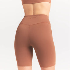 NikeSKIMS MATTE 7" BIKER SHORT | CAROB BROWN ON A MODEL SIDE VIEW @ | FOCUS: 0.0, 1.0, 0.9