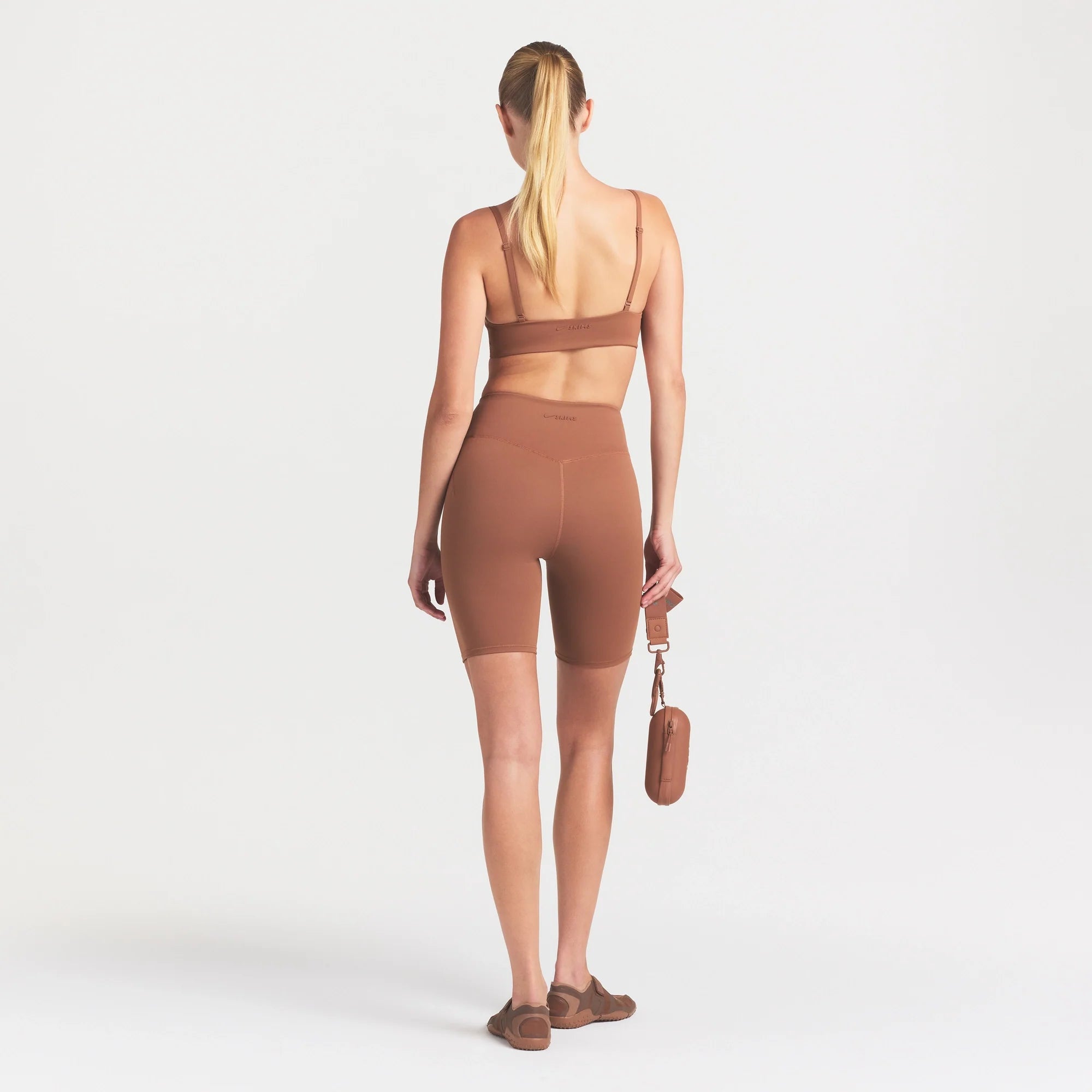 NikeSKIMS MATTE 7" BIKER SHORT | CAROB BROWN ON A MODEL FRONT VIEW