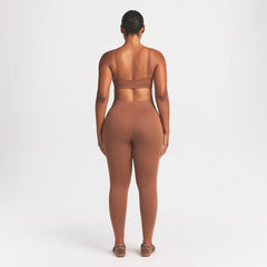 NikeSKIMS MATTE 26" LEGGING | CAROB BROWN ON A MODEL FRONT VIEW @ | FOCUS: 0.0, 1.0, 0.9