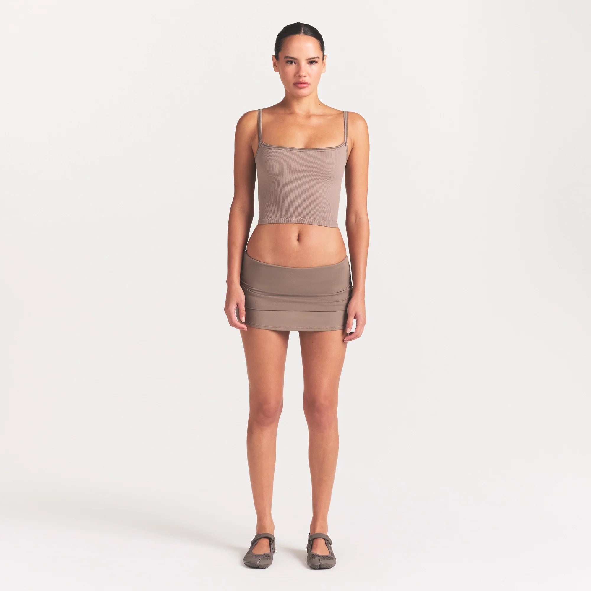 NikeSKIMS AIRY FOLDOVER SKORT | DRIFTWOOD ON A MODEL FRONT VIEW @ | FOCUS: 0.0, 1.0, 0.9