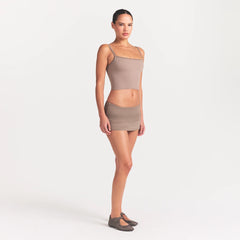 NikeSKIMS AIRY FOLDOVER SKORT | DRIFTWOOD ON A MODEL FRONT VIEW @ | FOCUS: 0.0, 1.0, 0.9