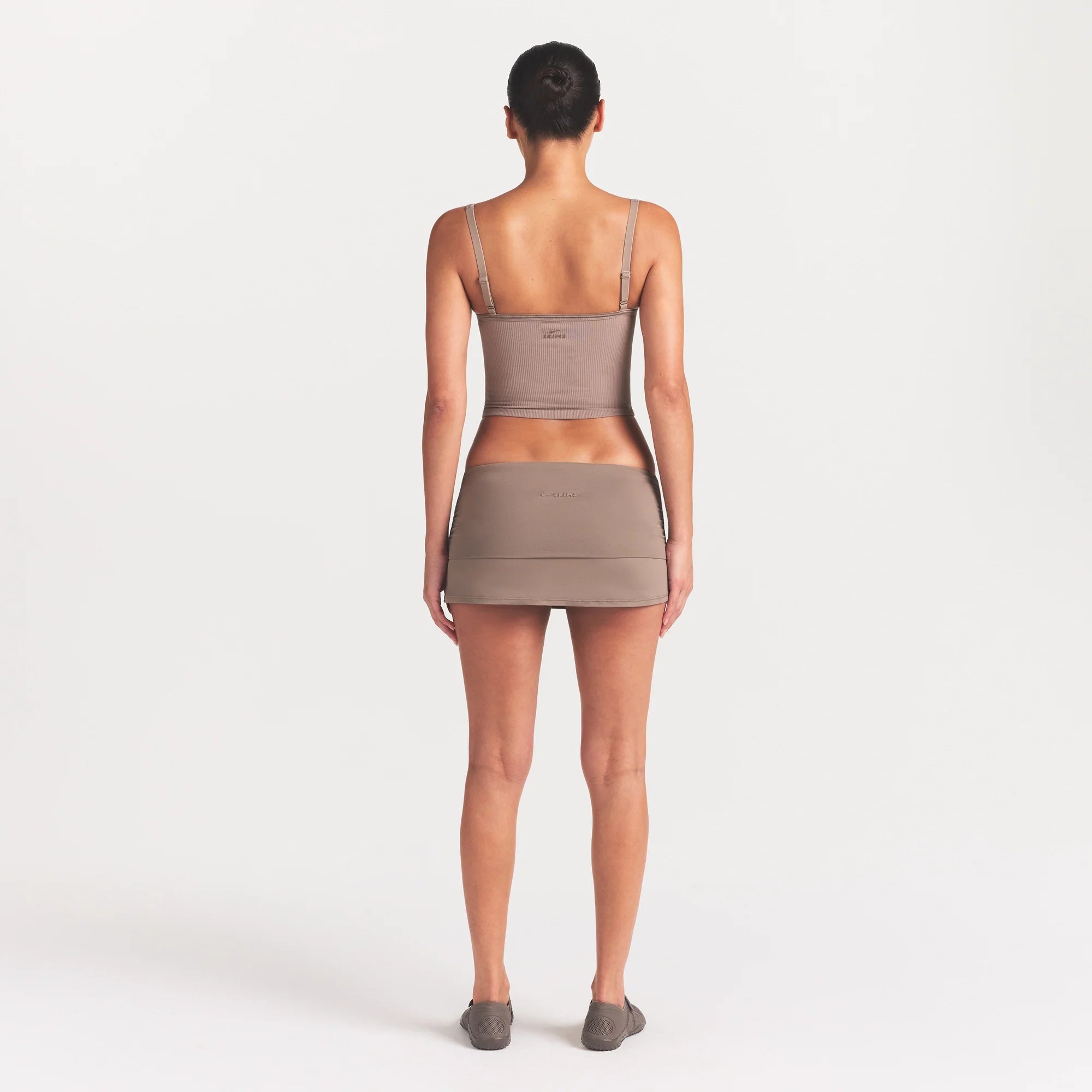 NikeSKIMS AIRY FOLDOVER SKORT | DRIFTWOOD ON A MODEL FRONT VIEW @ | FOCUS: 0.0, 1.0, 0.9