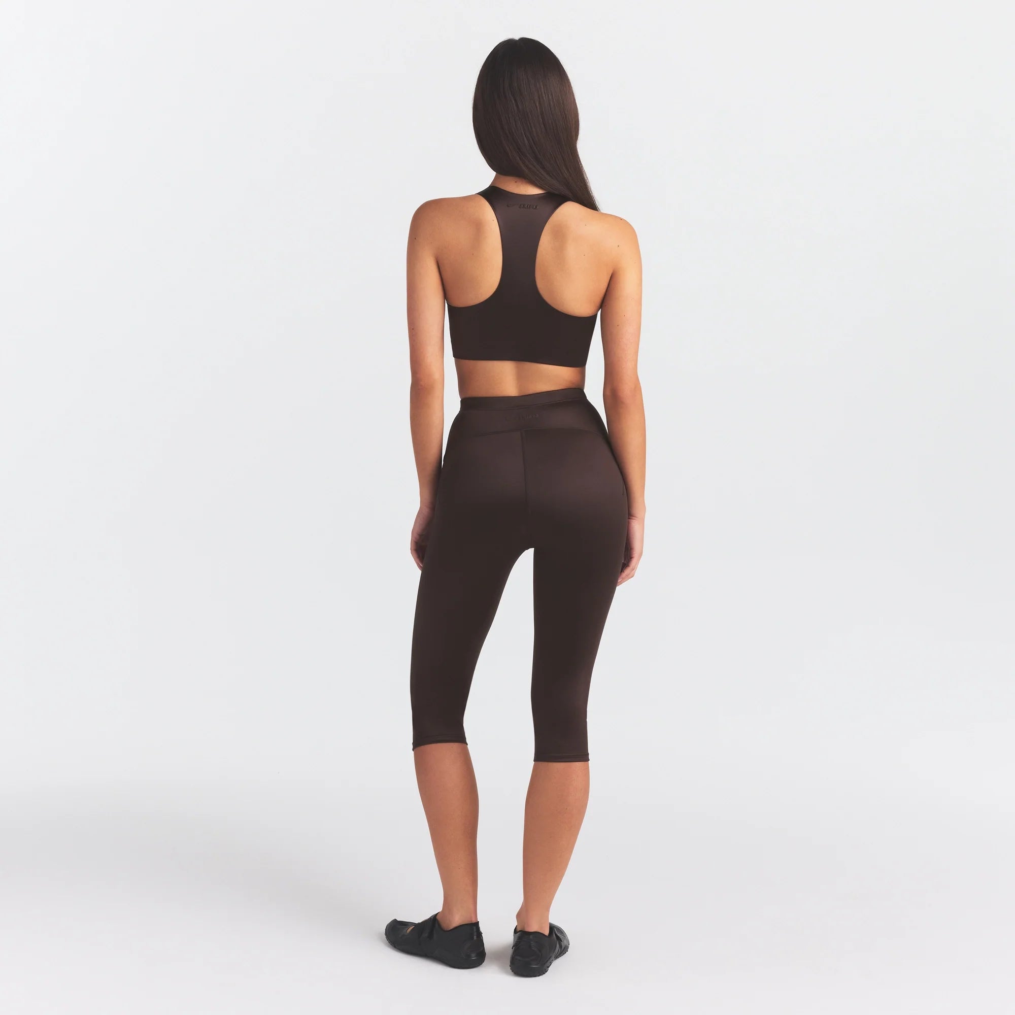 NikeSKIMS SATIN SHINE CAPRI 17" LEGGING | PHOENIX ON A MODEL FRONT VIEW
