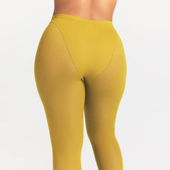 NikeSKIMS WEIGHTLESS LAYERS V-PANEL 28" LEGGING | CITRINE ON A MODEL SIDE VIEW @ | FOCUS: 0.0, 1.0, 0.9