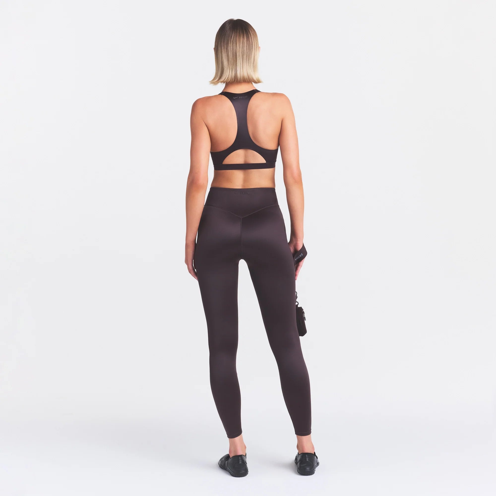 NikeSKIMS SATIN SHINE BONDED WAIST LEGGING 26" | PHOENIX ON A MODEL FRONT VIEW