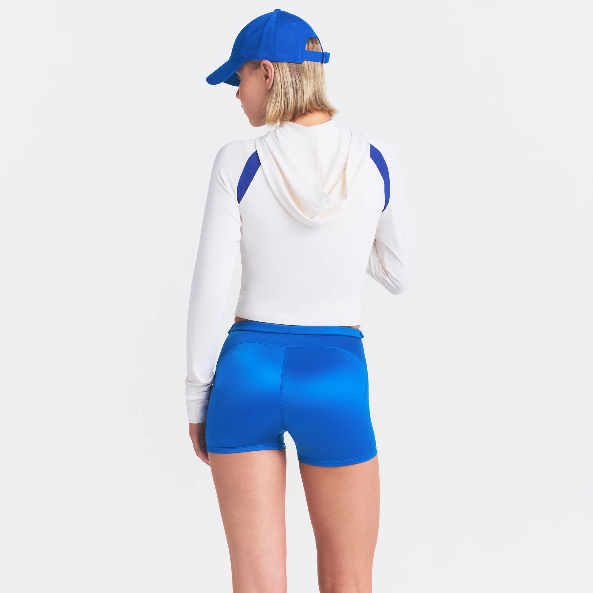 NikeSKIMS SATIN SHINE DRAWCORD 2" SHORT | COBALT ON A MODEL SIDE VIEW