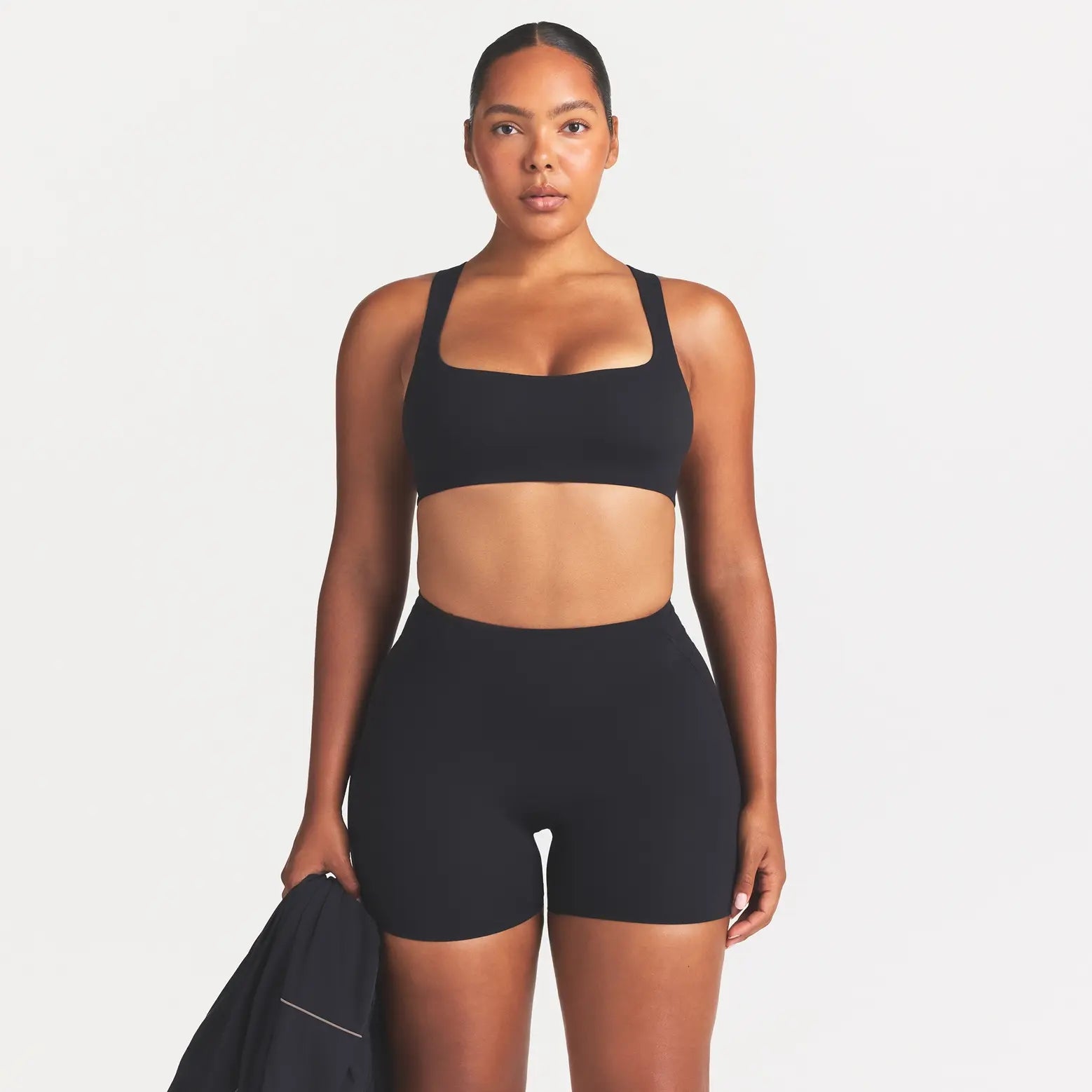 NikeSKIMS STUDIO STRETCH 5" BIKER SHORT | OBSIDIAN ON A MODEL SIDE VIEW @ | FOCUS: 0.0, 1.0, 0.9