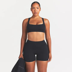 NikeSKIMS STUDIO STRETCH 5" BIKER SHORT | OBSIDIAN ON A MODEL SIDE VIEW @ | FOCUS: 0.0, 1.0, 0.9