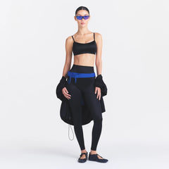NikeSKIMS SATIN SHINE BONDED WAIST 29" LEGGING | OBSIDIAN ON A MODEL FRONT VIEW