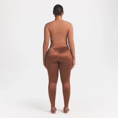 NikeSKIMS SATIN SHINE BONDED WAIST 29" LEGGING | CAROB BROWN ON A MODEL FRONT VIEW @ | FOCUS: 0.0, 1.0, 0.9