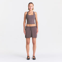 NikeSKIMS STRETCH KNIT DOLPHIN SHORT | RESIN ON A MODEL FRONT VIEW @ | FOCUS: 0.0, 1.0, 0.9
