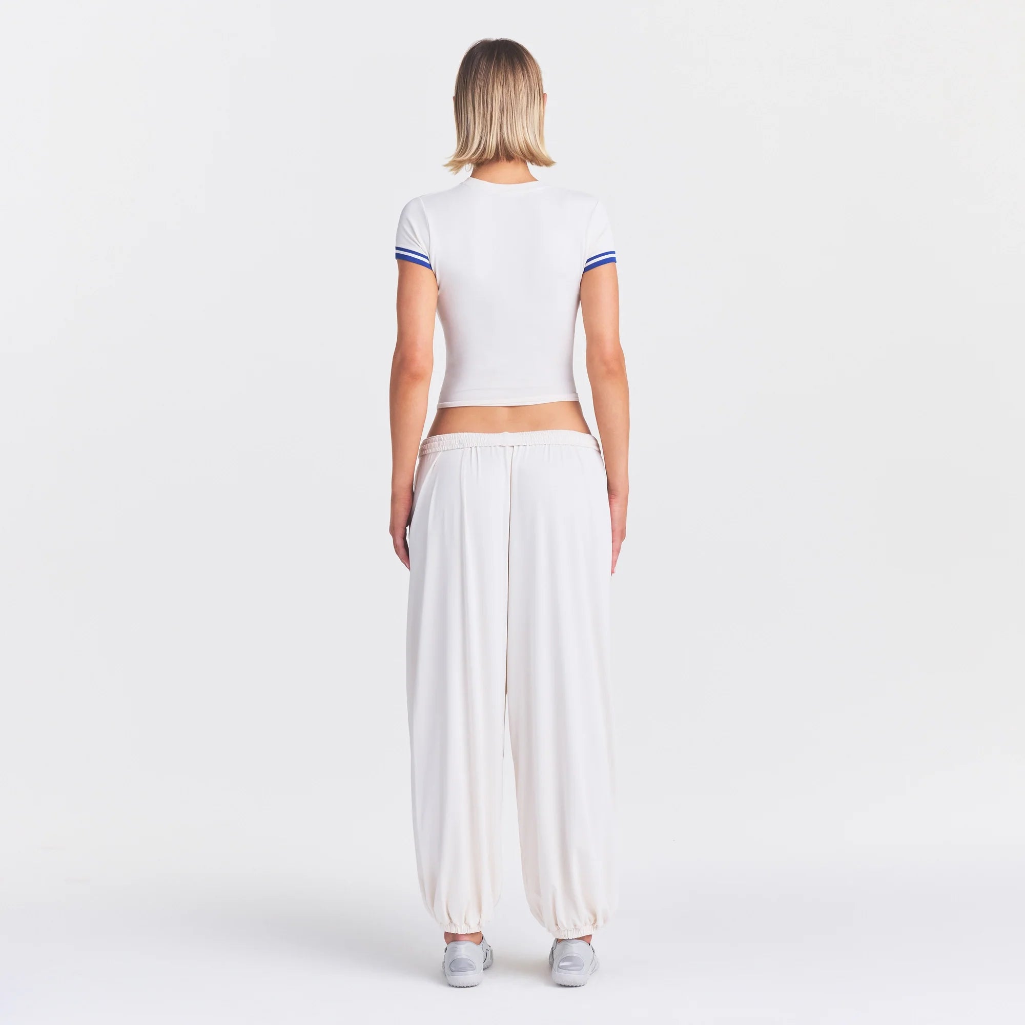 NikeSKIMS STRETCH KNIT BALLOON PANT | IVORY ON A MODEL FRONT VIEW @ | FOCUS: 0.0, 1.0, 0.9