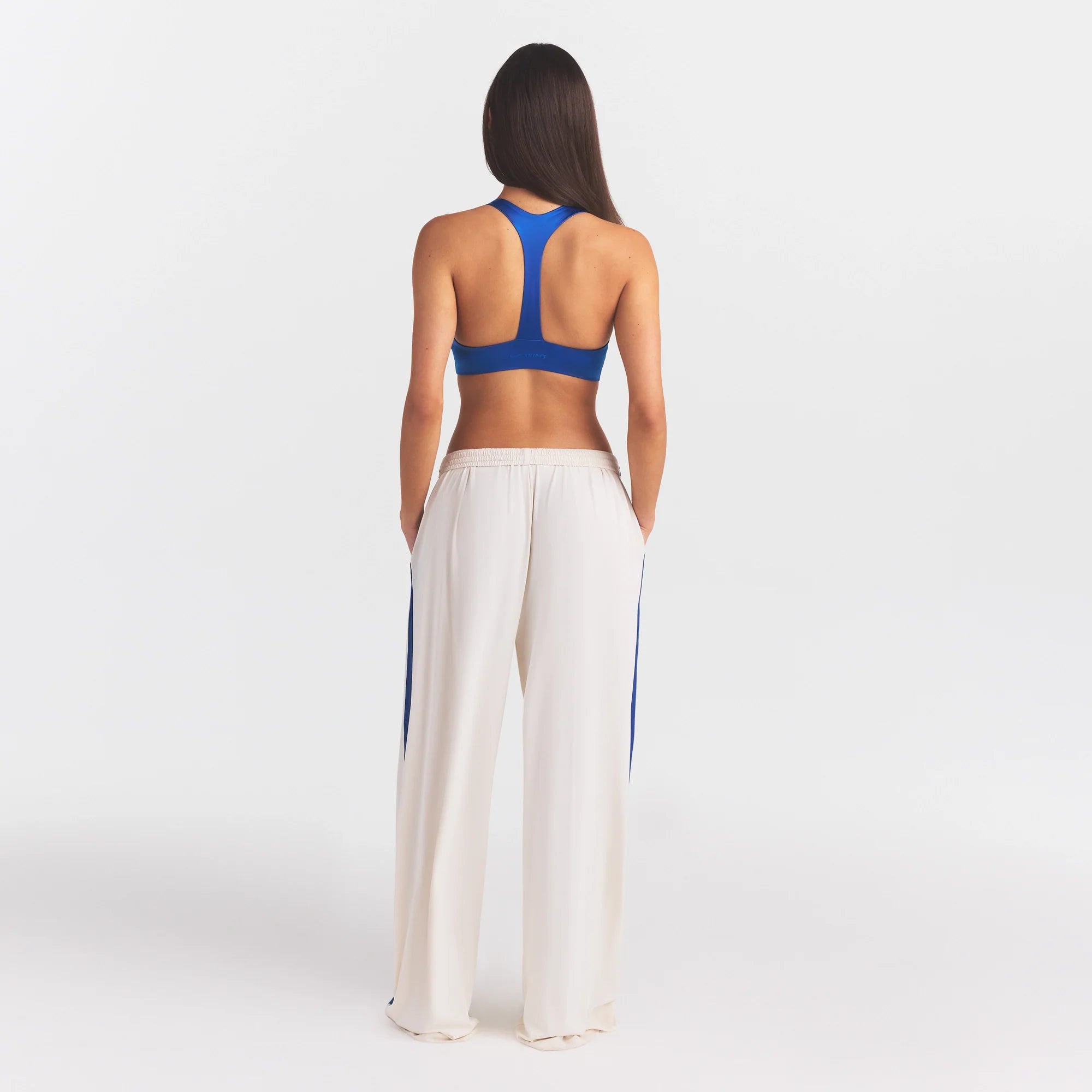 NikeSKIMS STRETCH KNIT WIDE LEG PANT | IVORY ON A MODEL FRONT VIEW @ | FOCUS: 0.0, 1.0, 0.9