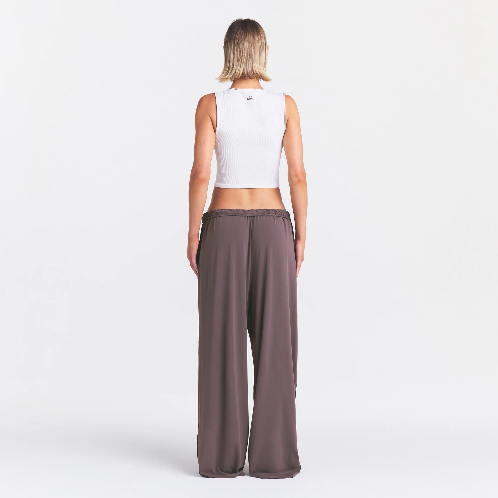 NikeSKIMS STRETCH KNIT WIDE LEG PANT | RESIN ON A MODEL FRONT VIEW @ | FOCUS: 0.0, 1.0, 0.9