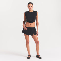 NikeSKIMS STRETCH NYLON SKORT | OBSIDIAN ON A MODEL FRONT VIEW
