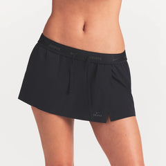 NikeSKIMS STRETCH NYLON SKORT | OBSIDIAN ON A MODEL SIDE VIEW