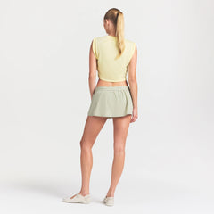 NikeSKIMS STRETCH NYLON SKORT | TALC ON A MODEL FRONT VIEW @ | FOCUS: 0.0, 1.0, 0.9