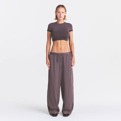 NikeSKIMS STRETCH NYLON OVERSIZED PANT | RESIN ON A MODEL FRONT VIEW @ | FOCUS: 0.0, 1.0, 0.9
