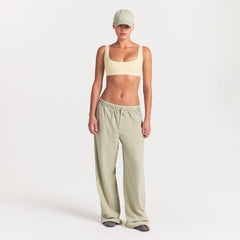 NikeSKIMS STRETCH NYLON OVERSIZED PANT | TALC ON A MODEL FRONT VIEW @ | FOCUS: 0.0, 1.0, 0.9