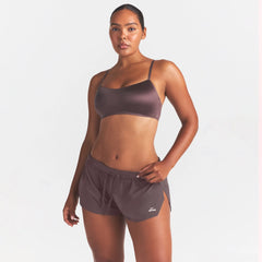 NikeSKIMS STRETCH NYLON RUNNER SHORT | RESIN ON A MODEL SIDE VIEW @ | FOCUS: 0.0, 1.0, 0.9