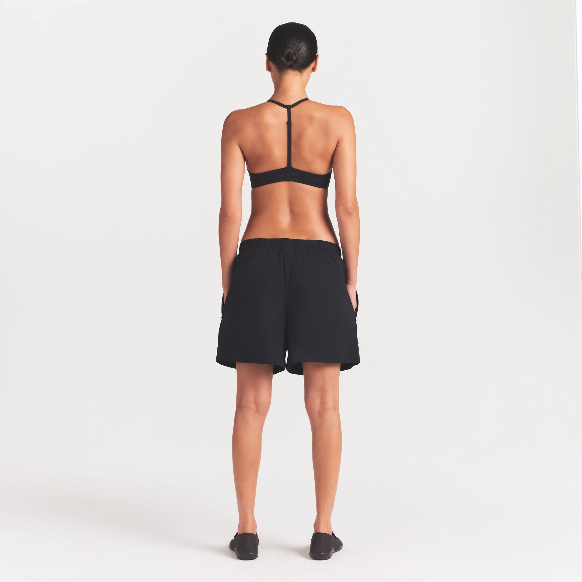 NikeSKIMS STRETCH NYLON 5" TRACK SHORT | OBSIDIAN ON A MODEL FRONT VIEW