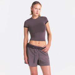 NikeSKIMS STRETCH NYLON 5" TRACK SHORT | RESIN ON A MODEL SIDE VIEW