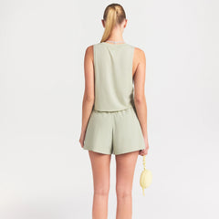 NikeSKIMS STRETCH NYLON 5" TRACK SHORT | TALC ON A MODEL SIDE VIEW @ | FOCUS: 0.0, 1.0, 0.9