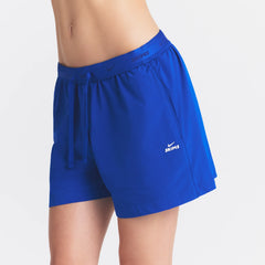 NikeSKIMS STRETCH NYLON 5" TRACK SHORT | COBALT ON A MODEL SIDE VIEW