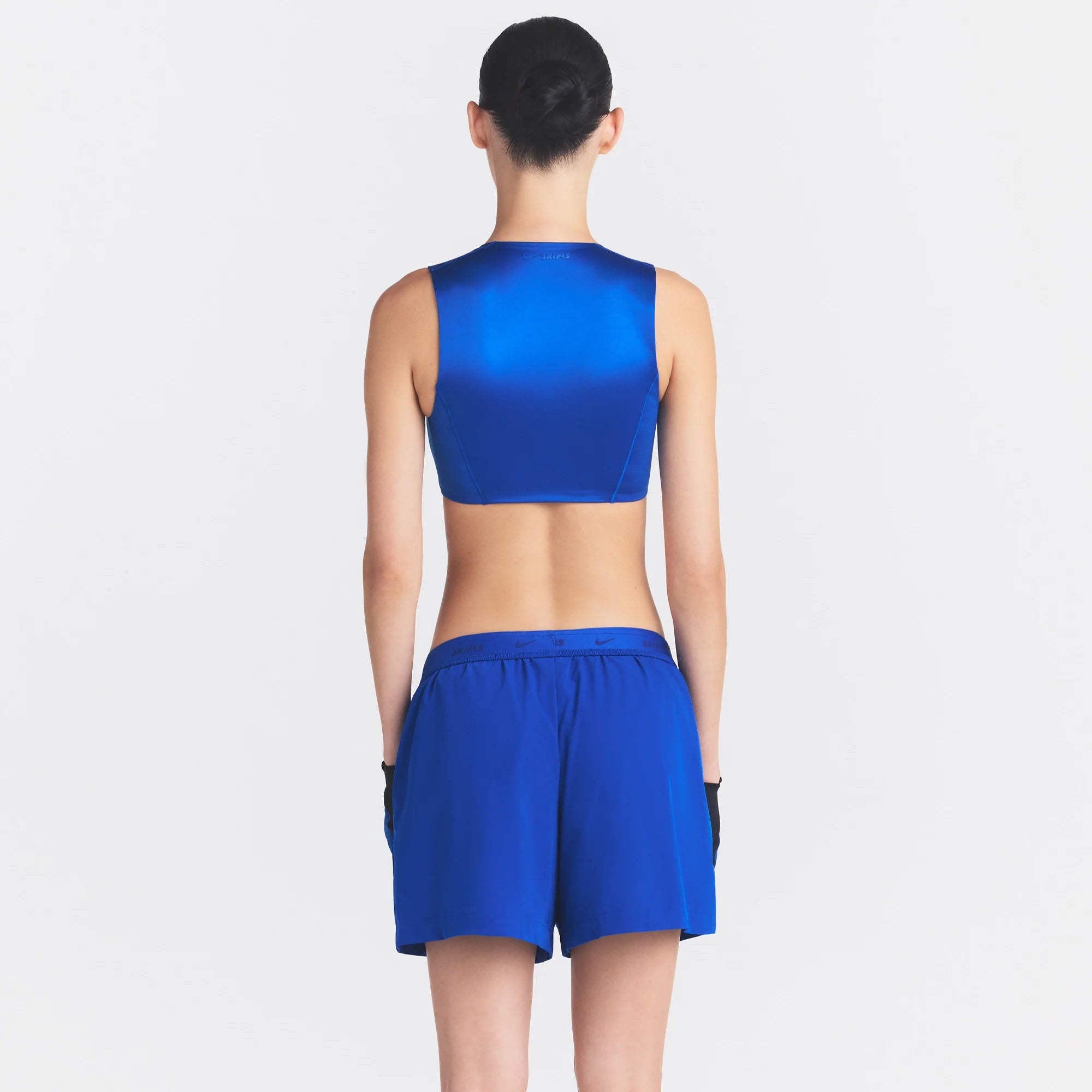 NikeSKIMS STRETCH NYLON 5" TRACK SHORT | COBALT ON A MODEL SIDE VIEW