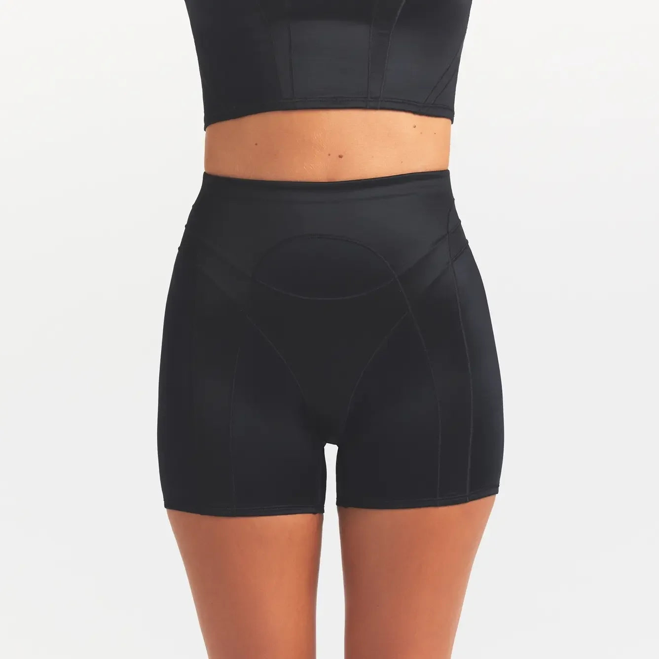 NikeSKIMS SATIN SHINE PANELED 5” BIKER SHORT | OBSIDIAN ON A MODEL SIDE VIEW @ | FOCUS: 0.0, 1.0, 0.9