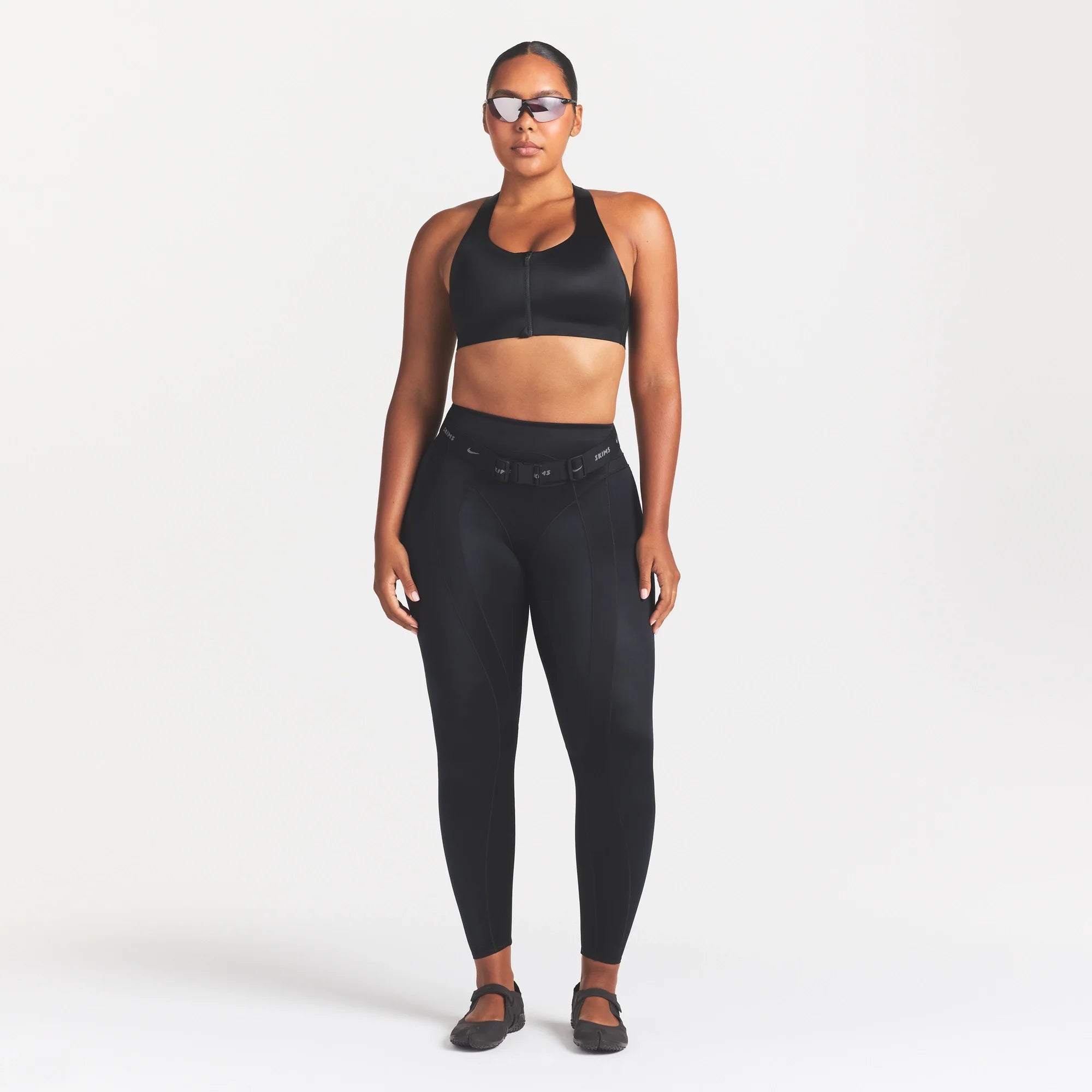 NikeSKIMS SATIN SHINE PANELED 26” LEGGING | OBSIDIAN ON A MODEL FRONT VIEW @ | FOCUS: 0.0, 1.0, 0.9