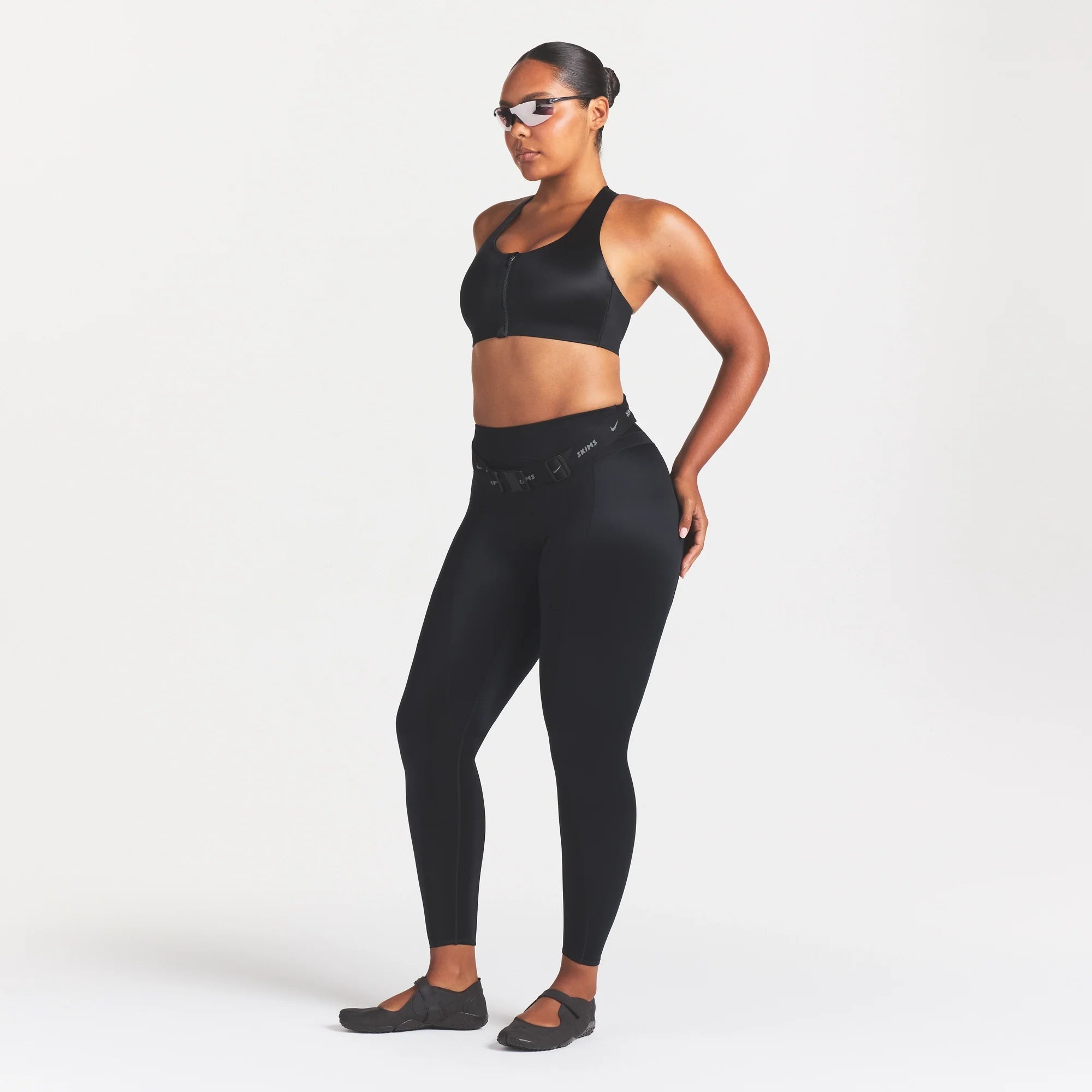 NikeSKIMS SATIN SHINE PANELED 26” LEGGING | OBSIDIAN ON A MODEL FRONT VIEW @ | FOCUS: 0.0, 1.0, 0.9