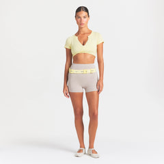 NikeSKIMS STUDIO STRETCH 3" SHORT | LINEN ON A MODEL FRONT VIEW @ | FOCUS: 0.0, 1.0, 0.9