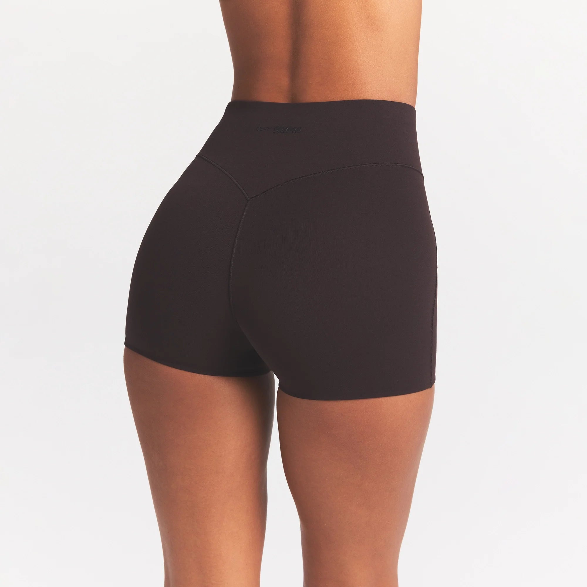 NikeSKIMS STUDIO STRETCH 3" SHORT | DARK ROAST ON A MODEL SIDE VIEW @ | FOCUS: 0.0, 1.0, 0.9